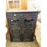 An oak two door lead glazed bookcase