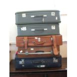 Five various vintage suitcases