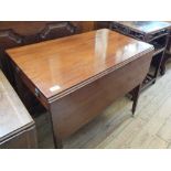 A Victorian mahogany Pembroke table on square tapered legs with single drawer