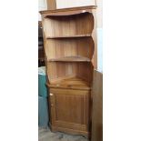 A pine corner cupboard