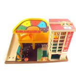 A Fisher Price garage plus cars and accessories