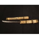 A Japanese Tanto with carved bone hilt and sheath (as found)