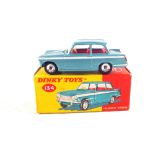 A boxed Dinky Toys 134 Triumph Vitesse in metallic aqua blue body with white flash