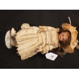 A German porcelain Herm Steiner dressed doll,