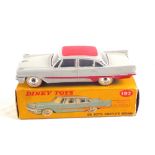 A boxed Dinky Toys 192 De Soto Fire Flite sedan with windows, grey body,