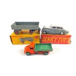 A boxed dinky 428 trailer with grey body and tyres, red hubs,