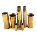 A collection of seven brass shell cases including a pair of German examples