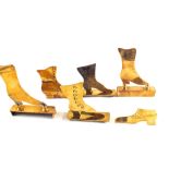 Six 'Trench Art' style brass shoes
