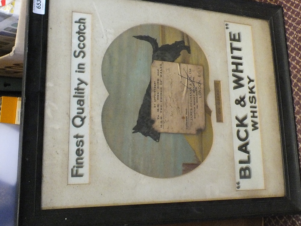 An original framed black and white Whisky advert,