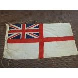 A Royal Navy white ensign flag with a William Rodgers deck knife