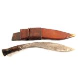 A military issue Kukri with its 1944 dated leather sheath