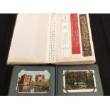 Two albums containing postcards,