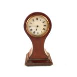 An Edwardian inlaid mahogany balloon clock