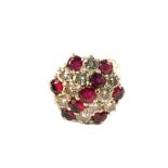 An 18ct white gold, ruby and diamond cluster ring, estimated total diamond weight 2cts,