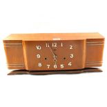 An Art Deco French mahogany striking mantel clock