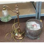 A copper table lamp with green glass shade,