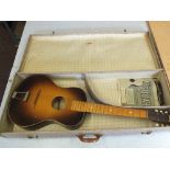 A cased John Gray & Sons acoustic guitar