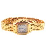 A lady's 18ct gold Cartier Panthere wristwatch with diamond set bezel and winder,