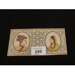 Two Indian portraits on pierced ivory plaque,