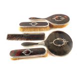 A silver and tortoiseshell brush and mirror set,