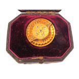 An unmarked gold memorial brooch set with five old cut diamonds to front and a panel for hair to