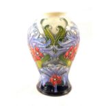 A boxed Moorcroft Florian Lilac pattern vase designed by Emma Bossons circa 2005,