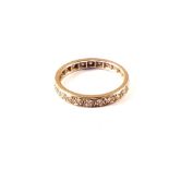 An unmarked and diamond set full eternity ring,