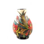 A boxed Moorcroft Satin Flower pattern vase circa 2008, with impressed marks to base,