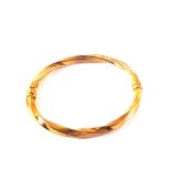 A 9ct gold bangle