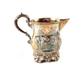 WITHDRAWN A Victorian silver cream jug with relief country scene with lady and dog decoration,