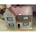 A wooden dolls house and furniture plus a wooden trolley