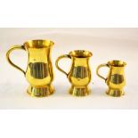 A set of three Scottish brass tavern measures of thistle form, pint, 1/2 pint and gill,