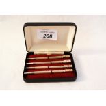 A cased set of four silver and enamel bridge pencils