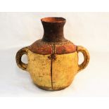 An ancient pottery flared neck jar with red ochre brown and cream decoration,