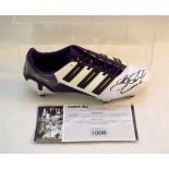 A cased Adidas Predator boot signed by Steven Gerrard with certificate of authenticity from Framing