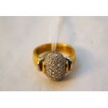 A heavy 18ct diamond encrusted ring,