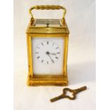 A brass carriage clock with presentation inscription from Lady Buxton and date 1865