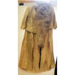 An Edwardian pale brown silk embroidered skirt and jacket plus an ostrich feather boa