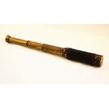 A brass four draw pocket telescope