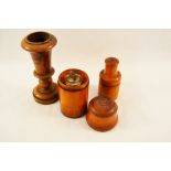 A glass bottle in treen container plus two other treen pieces,