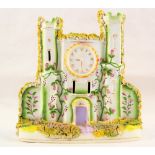 A 19th Century Staffordshire clock and castle ornament with floral encrustations