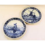 A pair of Delft windmill and figure wall plates