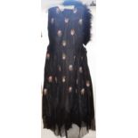 A 1920's black silk embroidered dress and a black ostrich feather boa