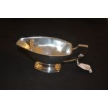 A silver sauce boat,