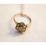 An 18ct white gold diamond cluster ring,