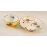 An early 19th Century Meissen yellow ground floral tea bowl and saucer (small chip and crack to