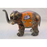 A Chinese pottery polychrome elephant (repaired trunk)