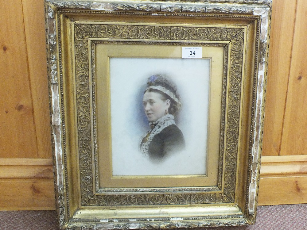 A Victorian oil portrait of head and shoulders of a lady,