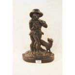 A Victorian iron man and dog doorstop