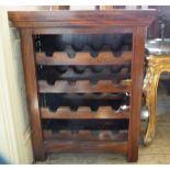 A mahogany and metal wire wine rack